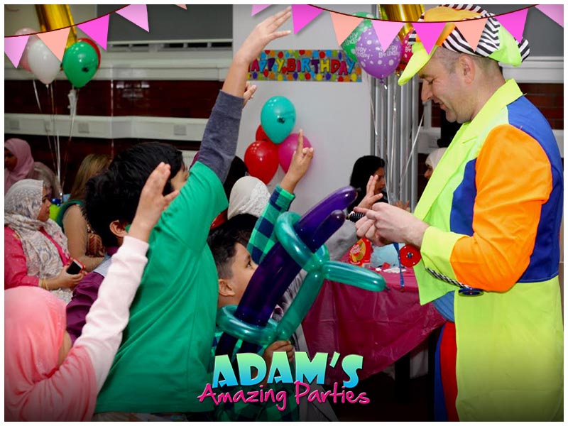 Adam with balloons, kids chasing and bubbles